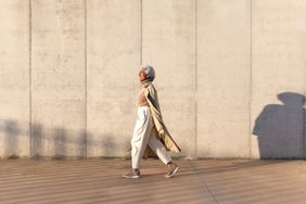a photo of a woman walking outside
