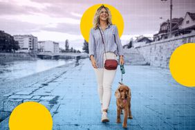 a photo of a woman walking her dog outside