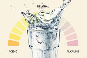 A glass of water with a PH scale in the background