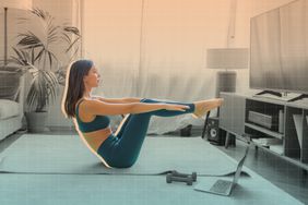 a photo of a woman exercising in her living room in front of the TV on a yoga mat 