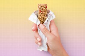 a photo of a hand holding a protein bar
