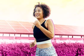 a photo of a woman jogging outside