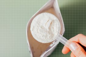 a photo of a scoop of supplement powder coming out of a bag